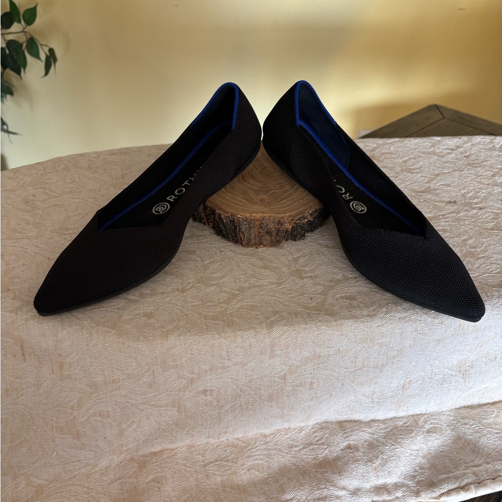 Rothy's Elegant Black Flats with Blue Accents